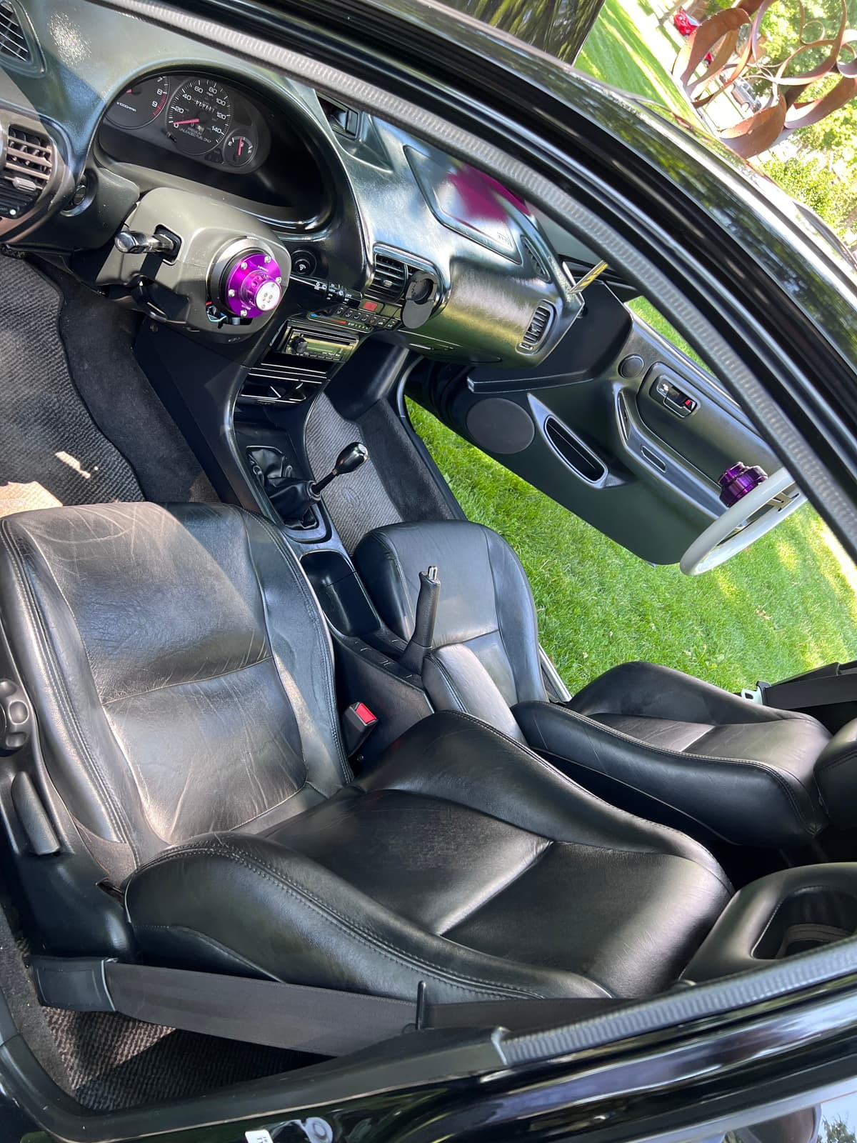 The Integra's driver's seat and the purple quick-release steering hub
